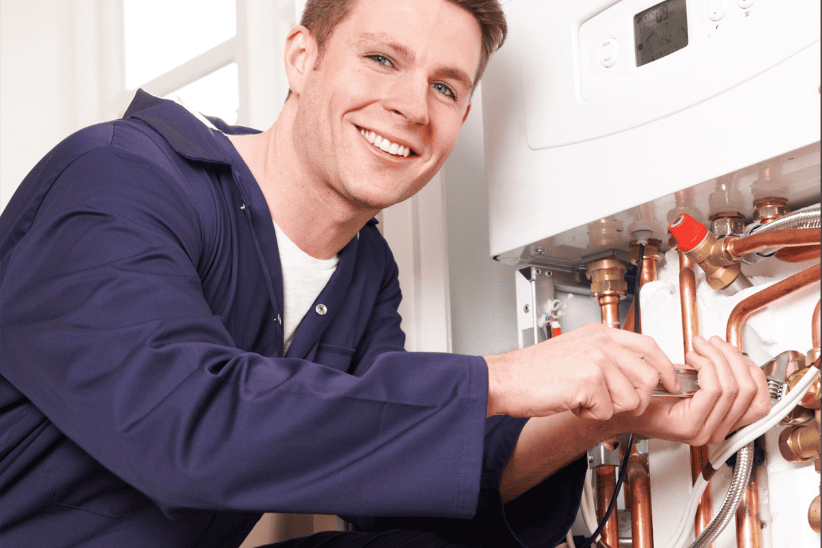 A photo showing a boilder being serviced by our Thornton Heath based heating engineer