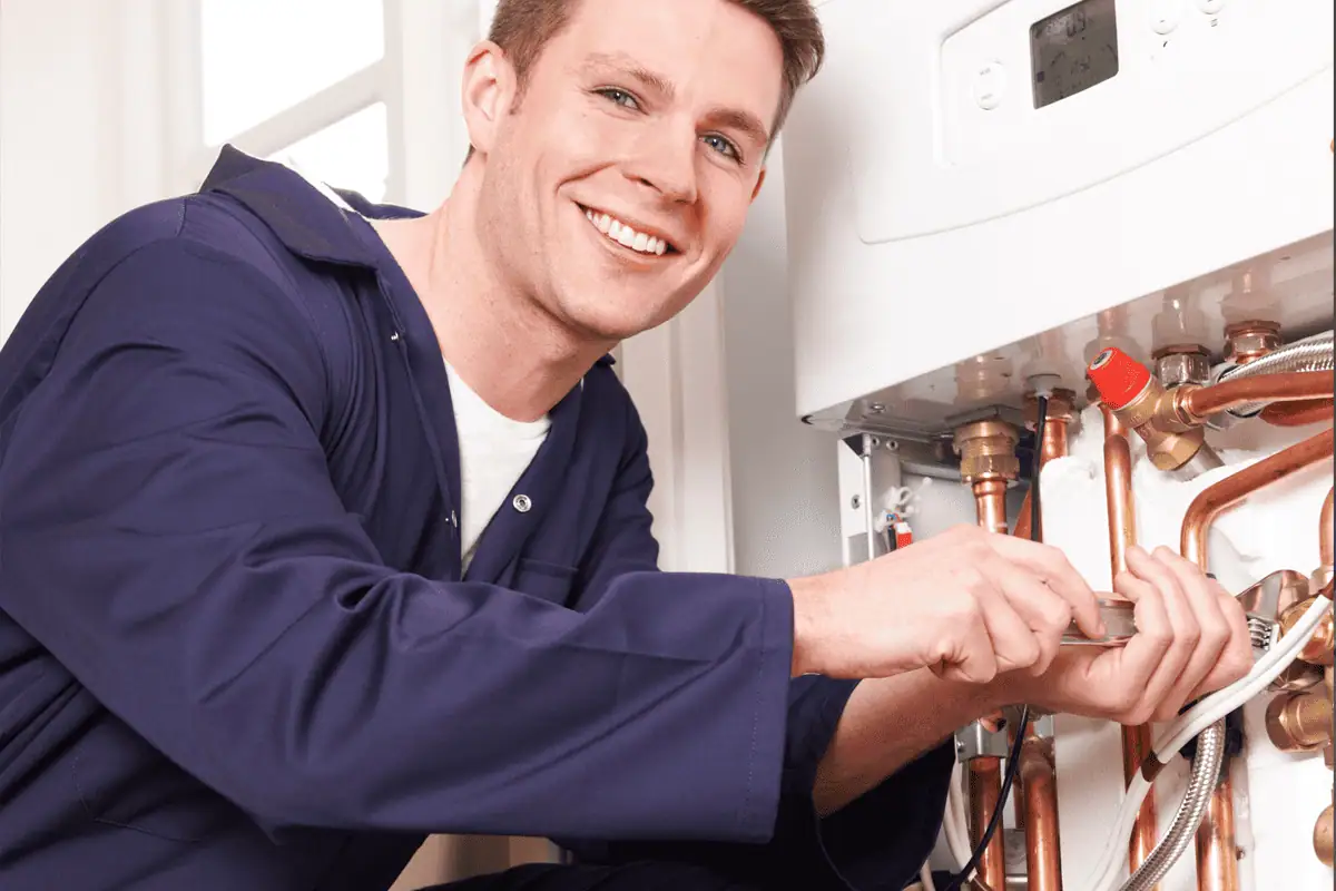 A photo showing a boilder being serviced by our Croydon based heating engineer